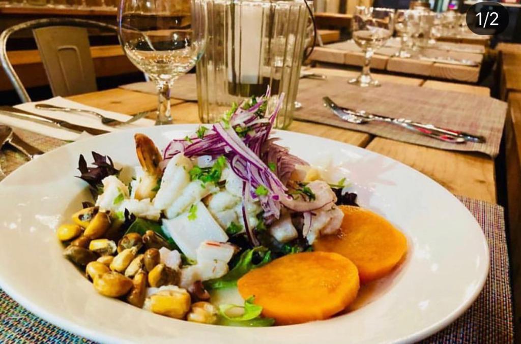 Mixto Ceviche · Today's fish with shrimp, octopus and calamari ceviche. Served with sweet potato and white corn. Spicy.