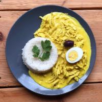 Aji de Gallina · Shredded chicken breast in creamy walnut and aji pepper sauce with olives an boiled eggs on ...