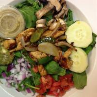 Grilled Chicken Spinach Salad · A blend of spinach, guacamole, tomatoes, onions, mushrooms and cucumbers topped with grilled...
