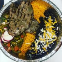 Carne Asada Platter · Thinly sliced beef cooked on a charcoal grill and served with salsa, tortillas, rice, beans,...