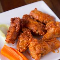 Spicy Buffalo Chicken Wings · Served with blue cheese dressing. 