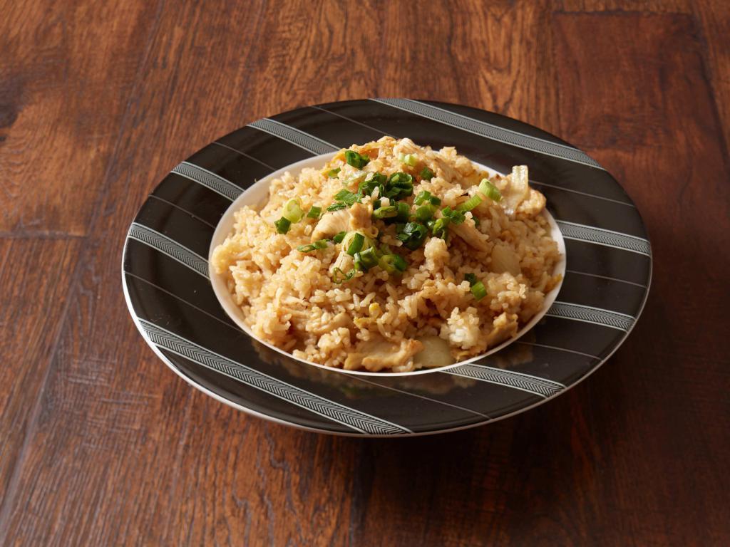50. Thai Fried Rice · Wok fried rice, eggs, yellow onions, and seasonings garnished with chopped green onions. Served with your choice of chicken, beef, or shrimp.