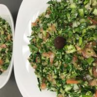 Tabbouleh Salad · Diced tomato, cucumber, onion, parsley, couscous, dressed with lemon juice and olive oil.