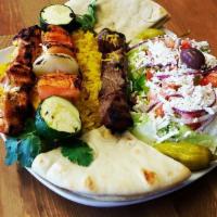 Chicken and Beef Tikka Plate · Served with yellow rice Greek salad, hot pita, 1 skewer of vegetable and skewers of chicken ...