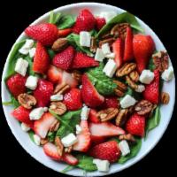 Strawberry Spinach Salad · Fresh strawberries, mixed greens, bacon, avocado, candied pecans, feta, honey vinaigrette.