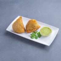 2 Piece Samosas · Homemade crisp patties stuffed with potatoes, green peas, and spices. Served with mint and t...