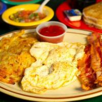 All American Breakfast · 2 eggs (any style) served with hash browns and bacon or sausage with 2 pancakes on the side.