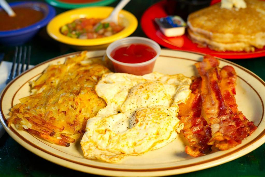 All American Breakfast · 2 eggs (any style) served with hash browns and bacon or sausage with 2 pancakes on the side.