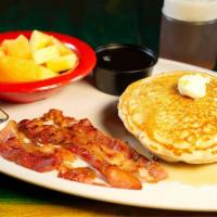 Pancakes · 3 pancakes served with bacon or sausage and side order of fresh fruit.