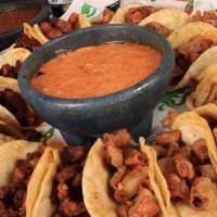 Taquito Party Platter · 18 taquitos. Choice of 2 from al pastor, pork carnitas, steak, pork adobada or tripitas. Ser...