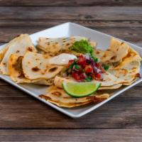 Quesadillas · Cheese and long green chile on flour or corn tortillas. Served with sour cream and guacamole.