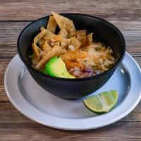 Tortilla Soup cup · Served with chicken topped with tostadas, cilantro, and cheese.