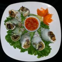 021. Thai Escargot · Grilled snail served with spicy seafood dipping sauce.