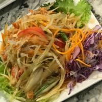 050 A: Sum Tum Thai Papaya Salad · Thai style papaya salad with carrot, green bean, tomato, garlic fresh chili, peanut, fish sa...