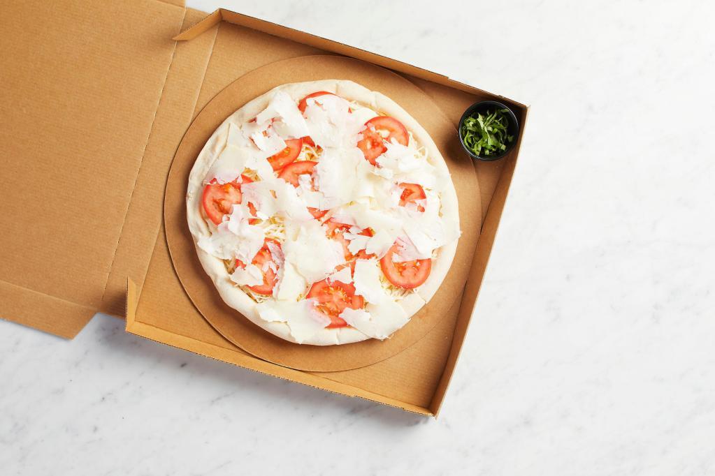 Take and Bake 5 Cheese and Fresh Tomato Pizza · READY TO BAKE - Fresh and traditional mozzarella, Monterrey Jack, smoked Gouda and Romano with tomato and fresh basil. Vegetarian.
