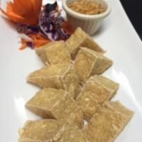 I1. 8 Pieces Golden Tofu · Fried triangle tofu. Served with sweet and sour sauce.