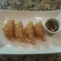 I5. 4 Pieces Fried Dumpling · Marinated ground pork vegetables served with black soy sauce.