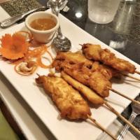 I9. 6 pieces Chicken Satay · Marinated tender chicken skewers. Served with peanut sauce.