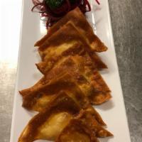 8 Piece Chicken Fried Wonton · Ground chicken marinated with salt and pepper wrapped in wonton shells. Served with sweet an...