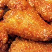 Hot Wings · Deep-fried saucy and crispy chicken wings in spicy sauce.