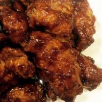 BBQ Wings · Deep fried saucy and crispy chicken wings in BBQ sauce.