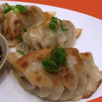 Pork Dumplings Gyoza · Fried or steamed pork dumplings served with sweet soy sauce.
