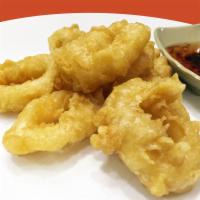 Calamari Rings · Deep fried calamari rings served with sweet and sour sauce.