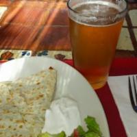 Cheese Quesadilla · Large grilled flour tortilla filled with fresh cheese, served with small salad with pico de ...