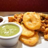 Vegetable Pakora · A delicious spiced combination of assorted vegetables deep fried in chickpea batter to golde...