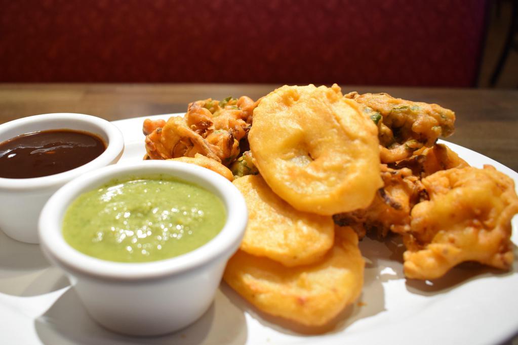Vegetable Pakora · A delicious spiced combination of assorted vegetables deep fried in chickpea batter to golden perfection. Vegetarian.