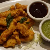 Chicken Pakora · Mildly spiced boneless chicken fritters, flavored with fresh onions, garlic and ginger.