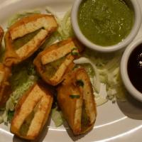 Cheese Pakora · Cheese cubes, delicately stuffed with chutney and deep fried.