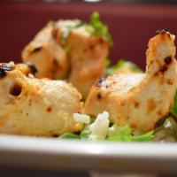 Murgh Malai Kabab · Creamy succulent pieces of chicken marinated with ginger, garlic and almond paste cooked in ...