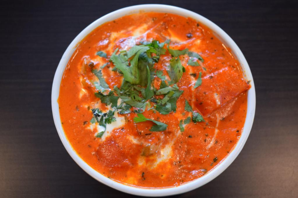 Paneer Mumtaz · Homemade cheese cubes cooked in a sauce with a rich tomato base and fresh herbs, finished with butter and topped with cream. Vegetarian.