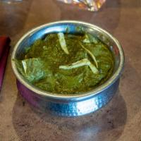 Palak/Saag Paneer · Freshly minced spinach cooked with cottage cheese cubes in a special blend of spices. Vegeta...
