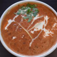 Dal Makhani · Black Lentil cooked with aromatic fresh tomatoes, ginger in butter and cream sauce.