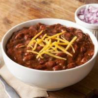 Texas Jailhouse Chili · Hearty chili with chopped red onions and cheddar cheese. Gluten free. 