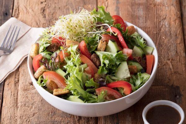 House Salad · Garden salad mix with tomato, cucumber, red bell pepper, clover sprouts, and topped with fresh baked croutons. Served with your choice of dressing.