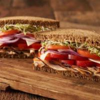 Sweet Liberty Sandwich · Turkey breast, Swiss cheese, red bell pepper, onions, tomato, clover sprouts, and Erik’s swe...