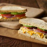 Sea Dog Sandwich · A generous serving of fresh tuna salad with cheddar cheese, avocado, tomato, onions, and Eri...