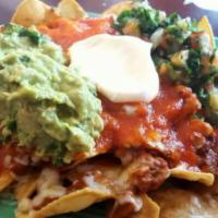 Cali Nachos · Your choice of meat, beans, sour cream, guacamole and pico de gallo with french fries.