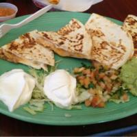 Super Quesadilla · Your choice of meat, sour cream and guacamole.