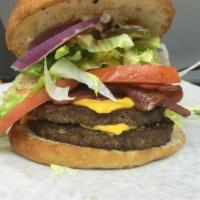 WTF 1/3 lb Double CheeseBurger · 2-1/3 lb. black Angus patties with lettuce, tomatoes, pickles, onions, and sauce.