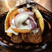 Gyro Sandwich · Delicious lamb and beef, cucumber sauce, tomatoes, and onion.