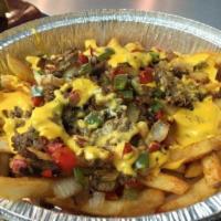 WTF Fries · Fries piled high with choice of meat, cheese, grilled onions, grilled peppers, and Maryln's ...