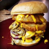 WTF Burger · 1/2 lb. patty, onion rings, grilled mushrooms, cheese wiz, tomatoes, lettuce, Maryln's sauce...