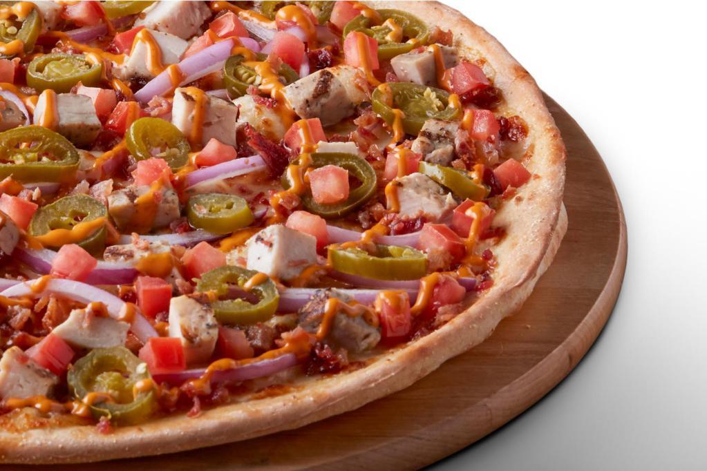 Chipotle Chicken Gluten Free Pizza · Signature Garlic White Sauce on our Gluten Free Crust, topped with Mozzarella Cheese, All-Natural Grilled Chicken, Bacon Bits, Jalapeños, Fresh Tomatoes, Red Onion, and a Chipotle Sauce drizzle.