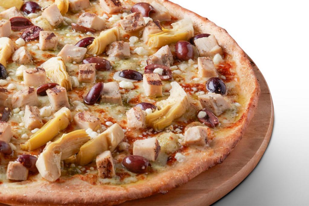 Creamy Pesto Chicken Pizza · Creamy pesto garlic sauce on our tuscany thin crust, topped with mozzarella cheese, all-natural grilled chicken, green olives, marinated artichoke hearts and feta cheese.