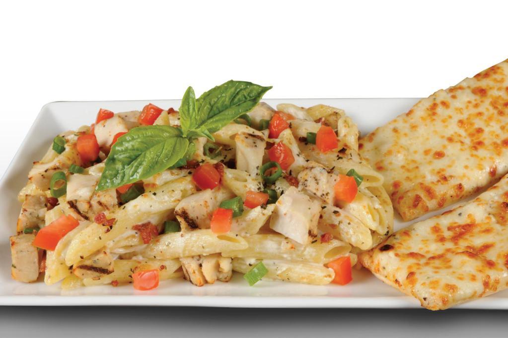 Penne Pollo Rustico Pasta · Penne Rigati, All-Natural Grilled Chicken, Smoked Bacon, Green Onions, and Tomatoes, all tossed in our Creamy Garlic Sauce and topped with Mozzarella and Fresh Basil.