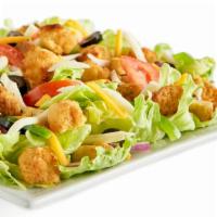 Crispy Chicken Salad · Iceberg lettuce, red onion, mozzarella cheese, cheddar cheese, chicken strip pieces, Roma to...